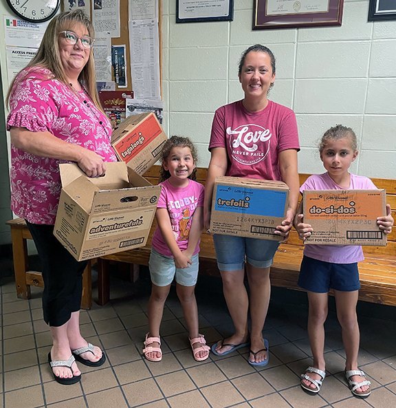 Girl Scout Troop 1033 presented Hendry County Sheriff's Office with boxes of Girl Scout Cookies. L-R: HCSO Human Resources Director Cindy West, Girl Scout Emma McAvoy, Troop Leader Alvie McAvoy and Girl ScoutAllie McAvoy.